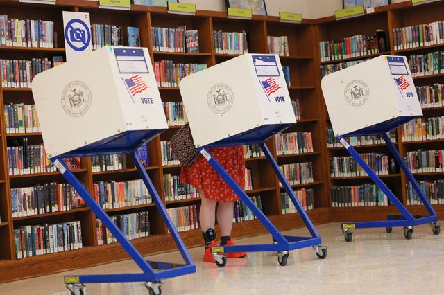 A voter behind a privacy booth inside a poll site during the June 28th primary.